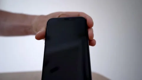 Process of mobile phone charging on an induction station pad. 4k stock footage. Vídeos de archivo 156419991