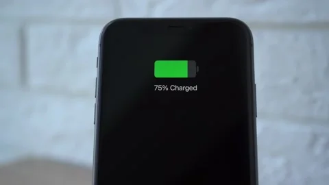 Process of mobile phone charging on an induction station pad. 4k stock footage. Vídeos de archivo 156420522