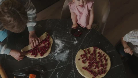 Process of molding cherry pies with grandma. Family dinner and celebration Stock Footage 246648858