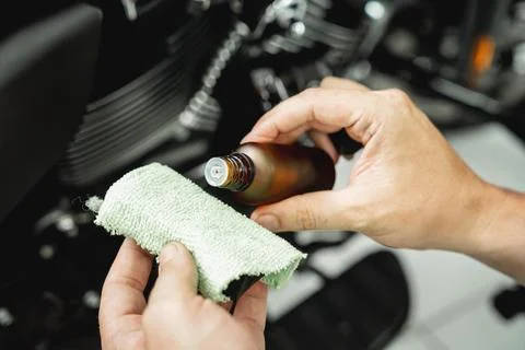 The process of nano coating motorcycle applying soft fiber sponge Stock Photos