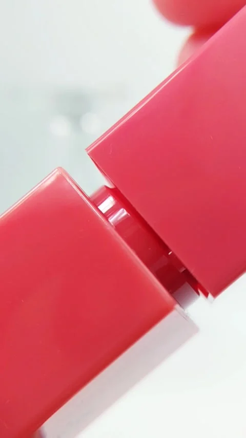 Process of opening a lip tint cap. Close up view focusing on the cap with s.. Stock Footage 332227427