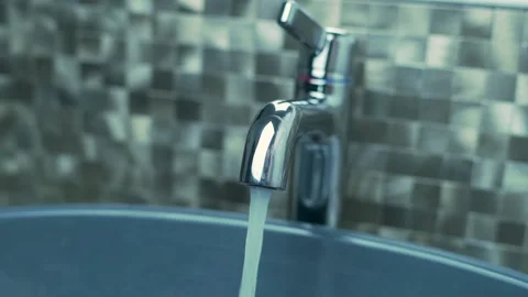 The Process of Operation of a Modern Faucet in the Bathroom for Washing Hands. T Stock Footage 141198439