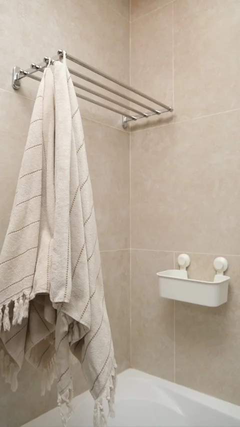 Process of organizing bathroom items, towels and detergents, vertical stop motio Stock Footage 270295384