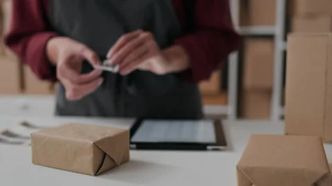 The process of packaging, sticking a barcode on a box, Packing and accountin Stock Footage 219866119
