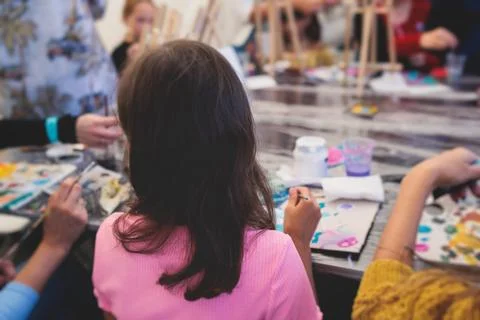 Process of painting, group class of young talented kids students with paint.. Stock Photos
