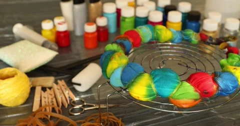 The process of painting in the style of tie dye 3 Stock Footage 131667553
