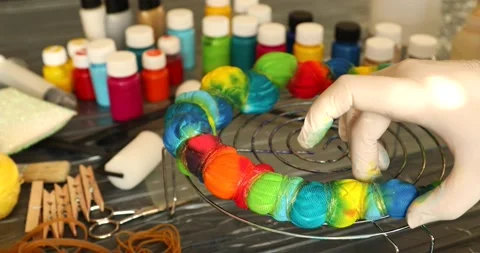 The process of painting in the style of tie dye 7 Stock Footage 131674745