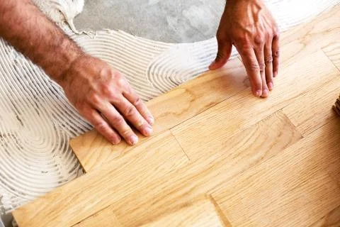 Process of parquet alignment in a closeup mode Stock Photos