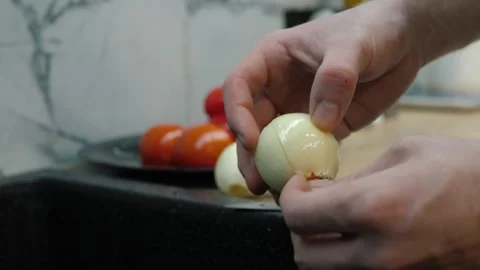 Process of Peeling Onions for Culinary Meal Preparation Stock Footage 311780750