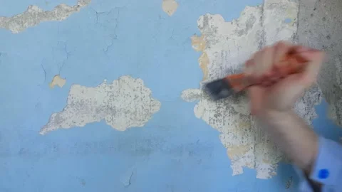 Process of peeling walls from old paint Stock Footage 142329888