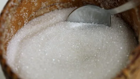 The process of picking up white sugar with a spoon from a sugar bowl close-up Stock Footage 161784643