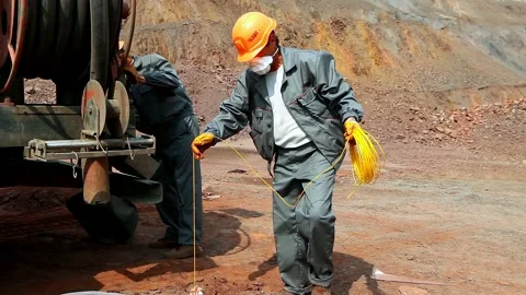 The process of placing explosives in an iron ore quarry. Explosives work in a Stock Footage 167603027