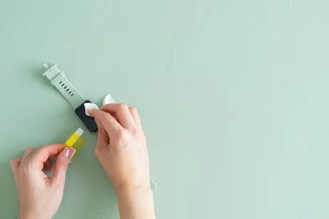 Process of placing the screen protector on a smart watch. Copy space. Stock Photos