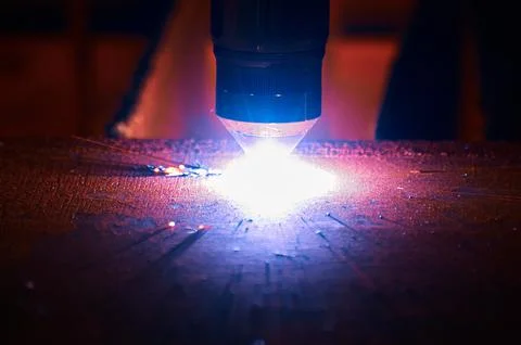 Process of plasma cutting machine tool operation in workshop Stock Photos