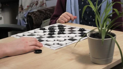 The process of playing the board game of checkers. Stock Footage 232031442