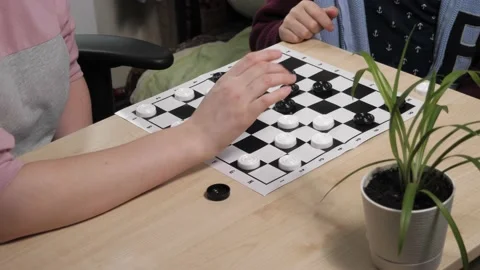 The process of playing the board game of checkers. Stock Footage 232031454