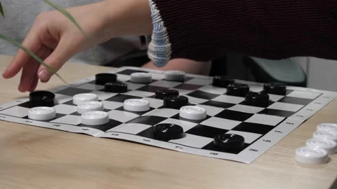 The process of playing the board game of checkers. Stock Footage 232031579