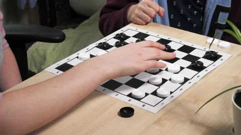 The process of playing the board game of checkers. Stock Footage 232031587