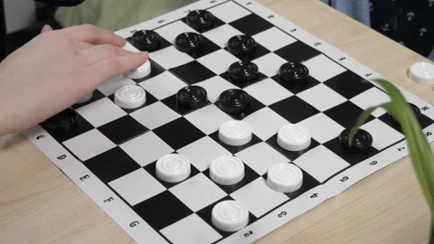 The process of playing the board game of checkers. Stock Footage 232031594