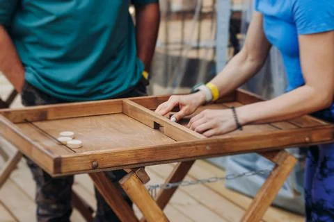 Process of playing tabletop board game on the table, fun with friends and f.. Stock Photos