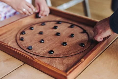 Process of playing tabletop board game on the table, fun with friends and f.. Stock Photos