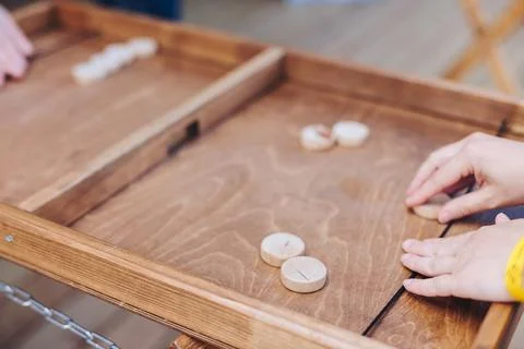Process of playing tabletop board game on the table, fun with friends and f.. Stock Photos
