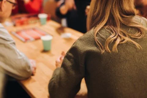 Process of playing tabletop board game on the table, fun with friends and f.. Stock Photos