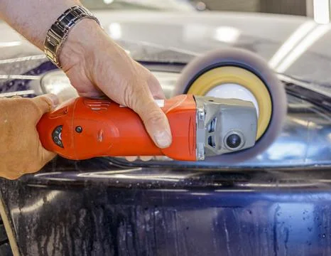 The process of polishing the headlights. Stock Photos