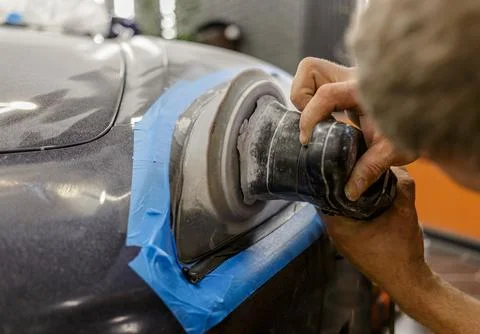 The process of polishing the headlights. Stock Photos