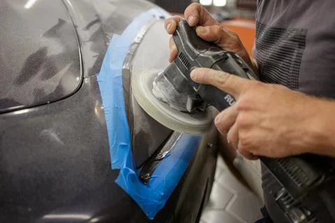 The process of polishing the headlights. Stock Photos