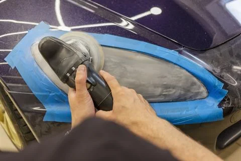 The process of polishing the headlights. Stock Photos