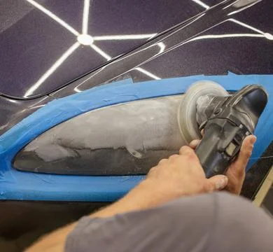 The process of polishing the headlights. Stock Photos