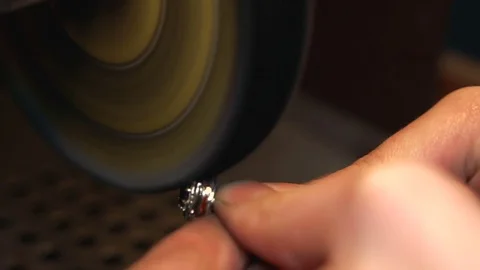 Process of polishing a silver ring on a polishing equipment close-up is the Stock Footage 73813935