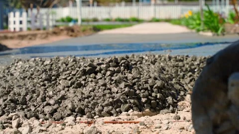 The process of pouring concrete, leveling concrete with a trowel Stock Footage 311170106