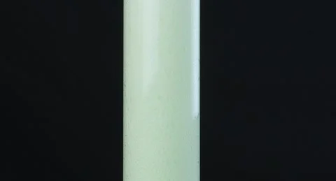 The process of pouring lemonade into a glass flask, background Stock Footage 253659718