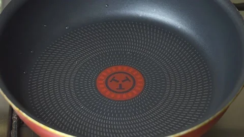 The process of pouring oil into the pan. Stock Footage 170217433