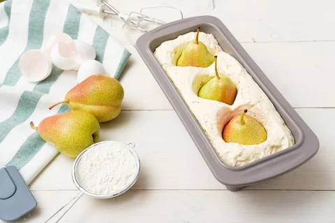 Process of preparation pie with whole pears on white background, pound pear c Stock Photos