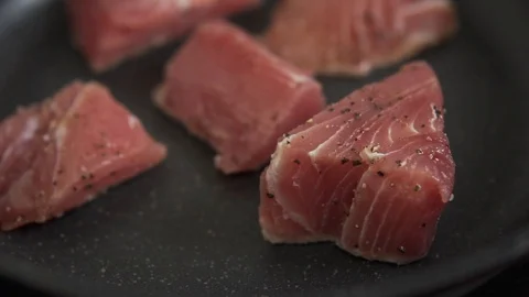 Process of preparation tuna steak. Roasting fillet of tuna. Slow motion closeup Stock Footage 91655831