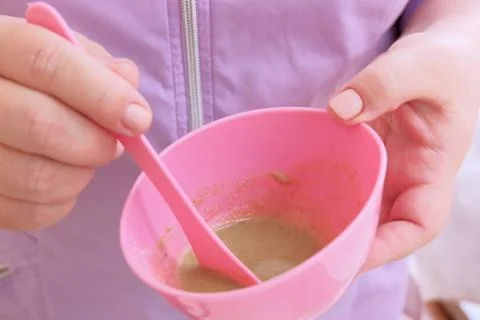 The process of preparing an alginate mask for face and body. Algae mask. Pink Stock Photos