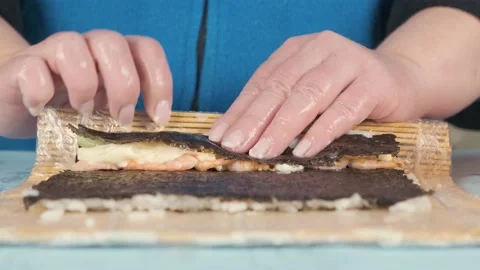 The process of preparing an Asian traditional dish of rice shrimp vegetables Stock Footage 131357645