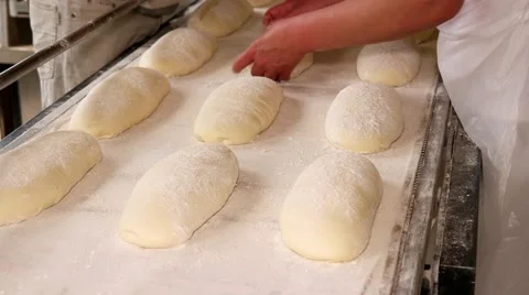 Process of preparing bread dough before being baked. Bread factory. Stock Footage 64471022