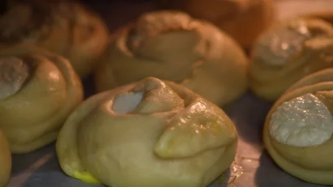 The process of preparing buns with cottage cheese curd in the oven, time lapse Stock Footage 261265114