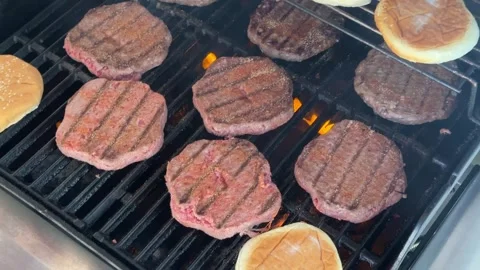 Process of preparing burger patties on the grill Stock Footage 241543305