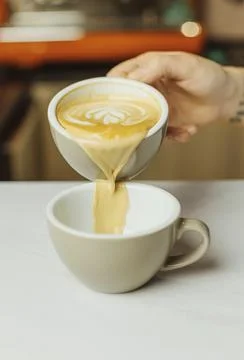 Process of preparing cappuccino on the cafe Stock Photos