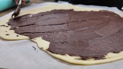 The process of preparing a chocolate pastry with buttery shortcrust dough Stock Footage 296098500