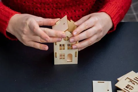 Process of preparing for Christmas and New Year eve. 3D craft wooden house... 스톡 사진