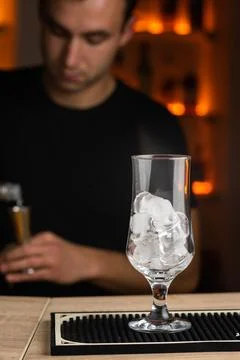 Process of preparing a cocktail bartender's in bar. Stock Photos