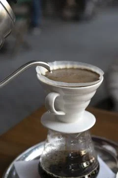 The process of preparing coffee with a filter .close-up of a cup of coffee Stock Photos