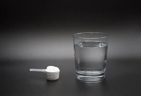 The process of preparing a creatine dietary supplement solution Stock Photos