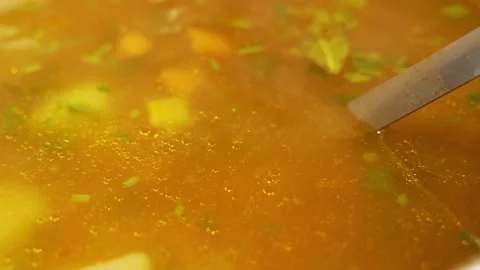 The Process of Preparing a Delicious and Healthy Soup of Greens, Vegetables and  Stock Footage 130904957